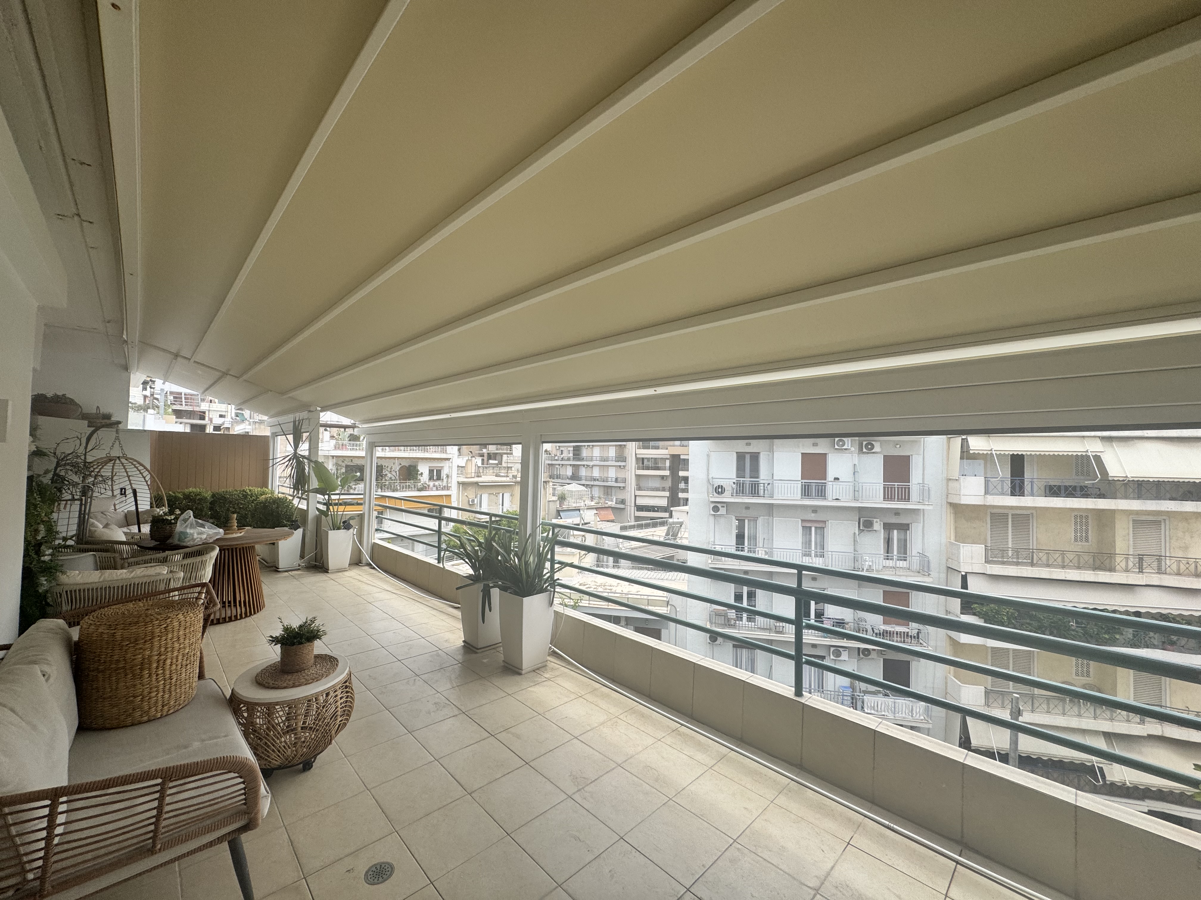 Pergola Awning and Automatic Vertical Zip Awnings on a Penthouse in Athens
